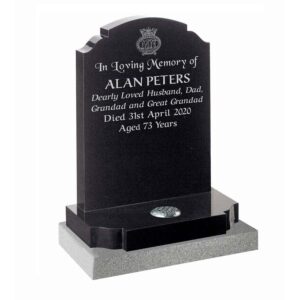 Black granite headstone with ogee shoulders