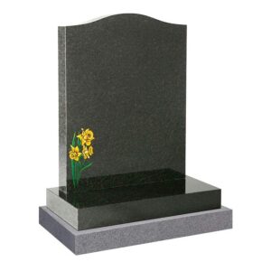A grey granite memorial with daffodil design