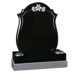 Ornate shaped black headstone with rose design