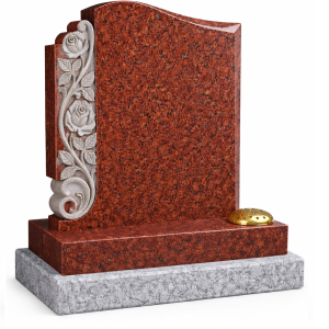 Red headstone with carvings